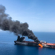 An oil tanker burning near the Strait of Hormuz, June 13, 2019.